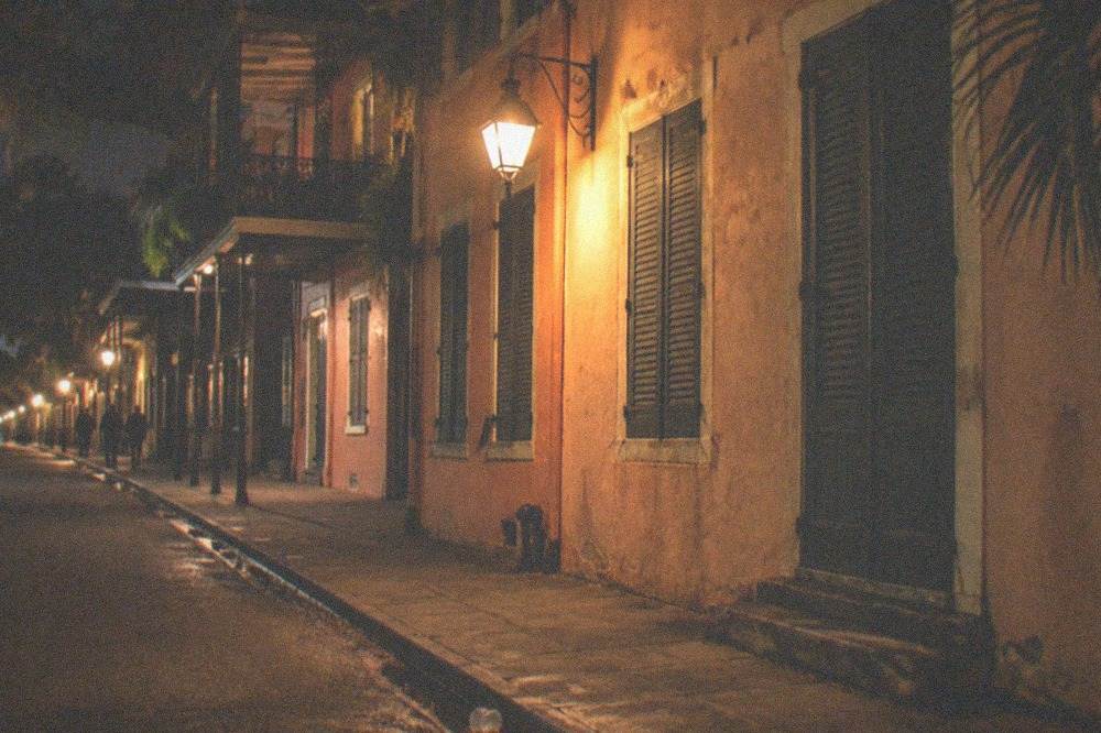 Historic French Quarter building facade lit at night